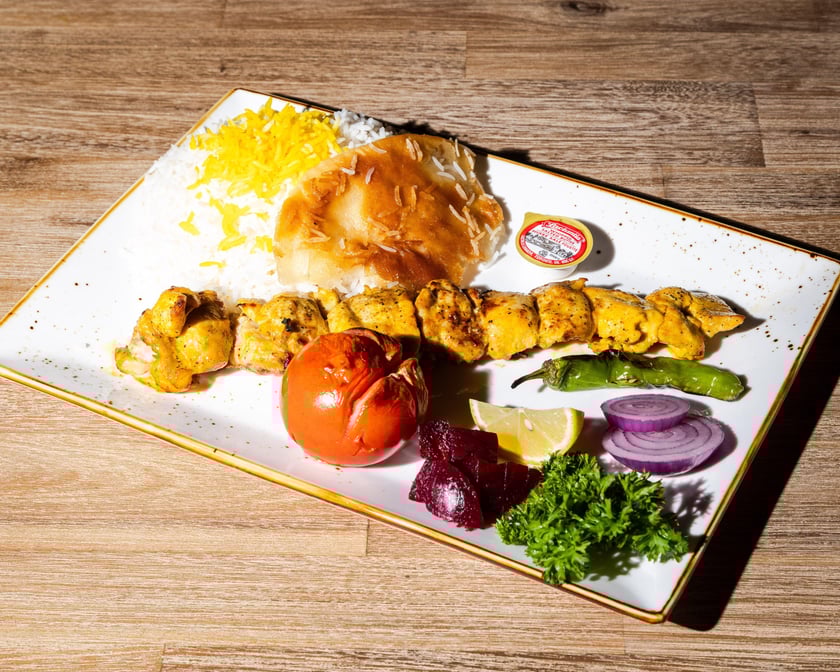 Signature Chicken Leg served with soup &pop / چلو جوجه کباب ران